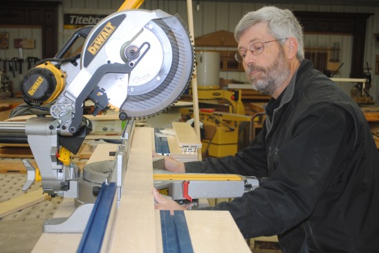 Using a straightedge, adjust the saw fence perfectly parallel with the wing fences.