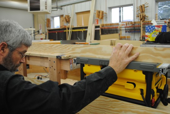Put the saw on the platform and use a straightedge to align it with the table before attaching the platform permanently.