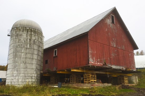 Our client’s silo was a concrete-stave type silo, built with interlocking concrete blocks (or staves) held in place by steel tension rods. The individual blocks were roughly 10 inches wide by 30 inches tall by 2 inches thick and were dry-laid—that is, interlocked together with no mortar. Though most of my barn restoration clients have gravitated towards smaller, diversified farming rather than dairy production—storing large amounts of feed (in silos) is no longer necessary—they typically want to keep their silos.