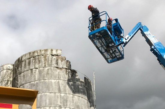 Because we had aerial lift equipment that could keep the crew above and out of the way of the silo, we felt that it was safest to remove the roughly 18 feet in diameter and 30 feet tall silo from the top down, in case something went wrong.