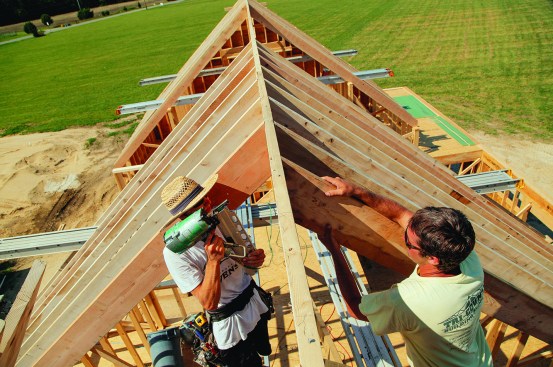 Pairs of rafters straighten and support the ridge. If the ridge needs to be tweaked in the opposite direction, the opposite side goes in first.