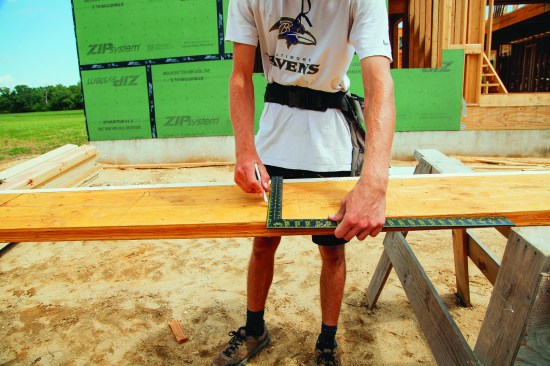 The crew laid out the rafters on one side.