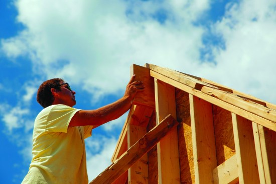 To set the height of a supporting ledger, the author set a scrap of the ridge stock into the slot on the gable.