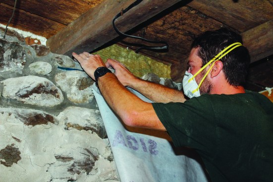 The air-barrier membrane was then pressed firmly to the tape.
