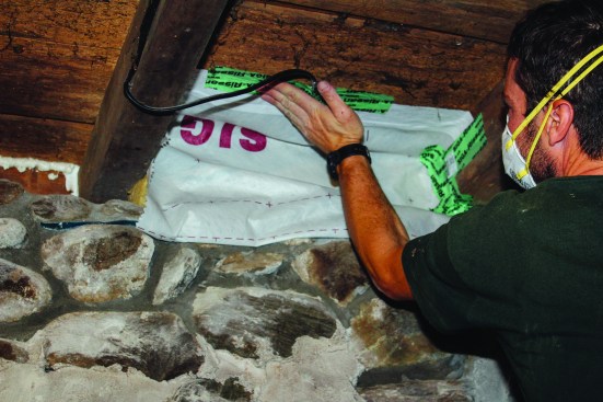 Next, the membrane was folded up and tailored to fit around framing and
mechanicals.