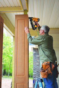 He fastened the first half of the column to the post with galvanized finish nails.