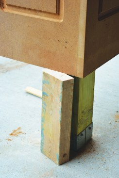It is held at its proper height with a 2x4 spacer block.
