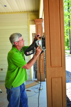 After allowing the glue to set, the author removed the clamps and used a belt sander to smooth the edges.