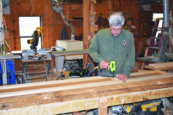 Then he tacked them in place with a brad nailer.