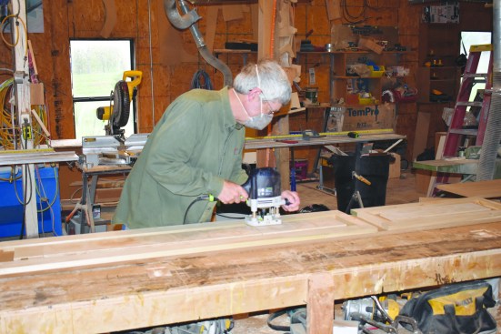 After plunging the router into the material, the author routed the edge pattern into the MDF, keeping the bushing in contact with the template at all times.