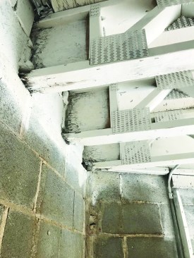 Removing water-damaged ceilings and walls revealed three trusses with rotted ends.