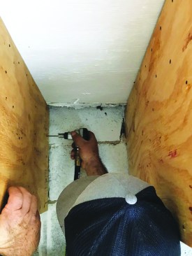 A palm nailer was used to drive the specified fasteners at each location to attach the gussets to the ends of the trusses.