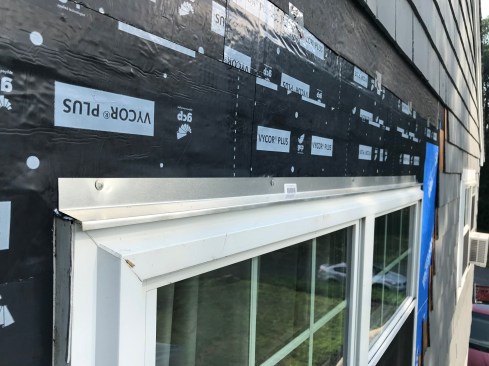 The author installed a length of aluminum drip cap over the window.