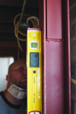 Each beam gets a final check for plumb.