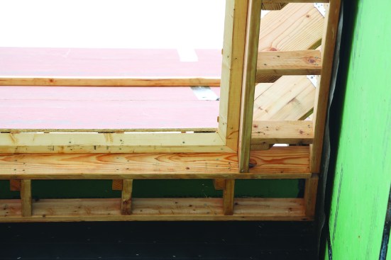 Seen from below, blocking between the subfascia and the wall adds plenty of nailing surface for attaching a wider soffit.