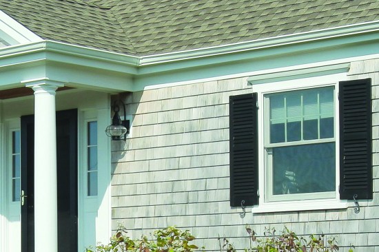 A frieze board captures the top edge of the siding while closing the joint between the soffit and the wall.