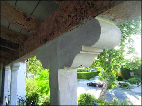 …and new capitals are installed on either side of the new posts.