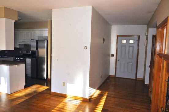 The basement stairwell interrupted traffic flow to the front door and turned the kitchen, dining room, and living room into spaces that felt cramped. Stacking the two staircases allowed us to open up the entire space while creating a roomy kitchen.