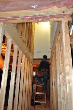 In the basement, we framed simple 2x4 walls for both sides of the new stairway. These walls were supposed to be continuations of the closet walls above.