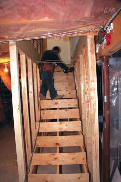After hanging the stringers, we installed solid risers made from CDX plywood.
