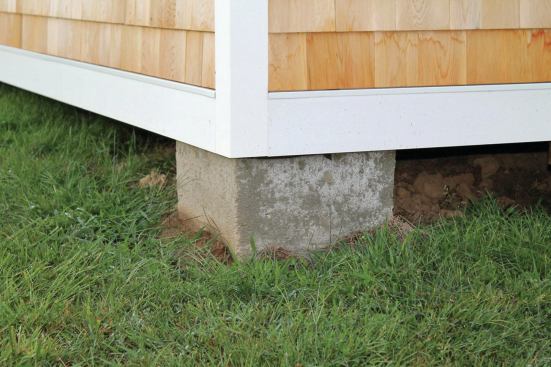 Substantial-looking square piers are perfectly aligned at the corners and edges of the building.