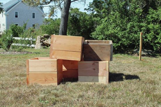 Scrap materials work fine for making form boxes. The boxes are a few inches deeper than the part of the pier that will appear above grade so that the forms can extend a bit into the ground.