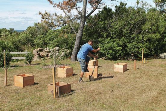 The sod in each footing location needs to be cut to the size of the boxes.