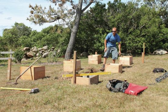 Digging out flat areas where the forms will sit makes a clean and level base for each one.