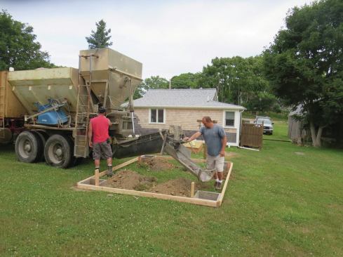 A dry-mix truck makes it easy to have the right amount of concrete mixed and poured on site.