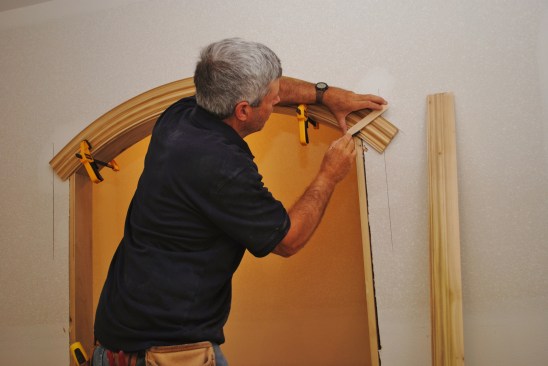 With the arch clamped in place, draw a line between the inside and outside marks for the miter cut on one side.