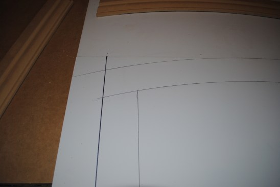 Draw lines on both sides of the jamb legs up to where the lines intersect with the arch.