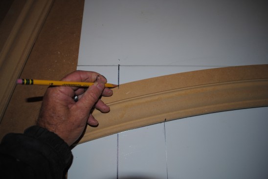 Set the arch back on the layout table and transfer the intersecting points onto the arch. A line between the two marks will be the miter cut.