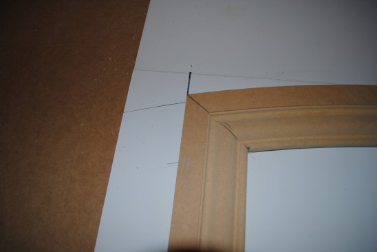 Working on the table, the side jamb miters can be tweaked until they are perfect. Then they can be cut to length to fit the finished floor.