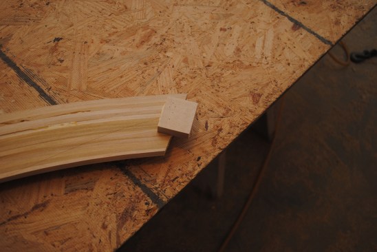 A good way to connect the arch to the side jambs is with small gussets glued and pinned to the back side of the trim.