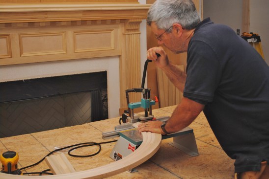 One of the best ways to  join the arched trim to the side jambs is with a dovetail machine that cuts small dovetail-shaped slots.