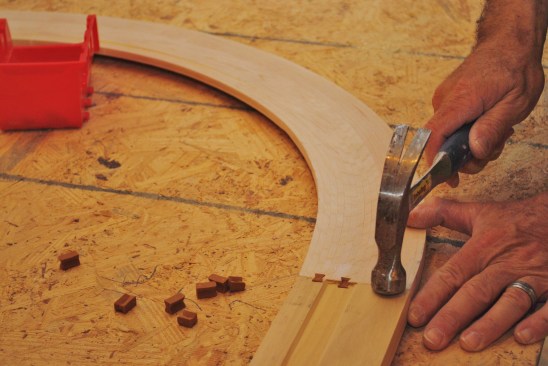 When matching dovetail slots are cut in both trim boards, small "keys" hammer in to draw the pieces together.