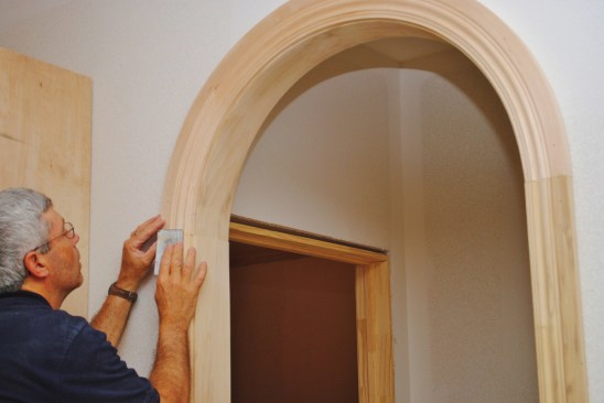 Sand paper smooths out the profile transitions between the arch and the side jambs.