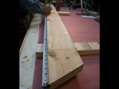 Rafter length. I can now hook a tape measure on the long point of this plumb cut and measure for the length of the rafter.