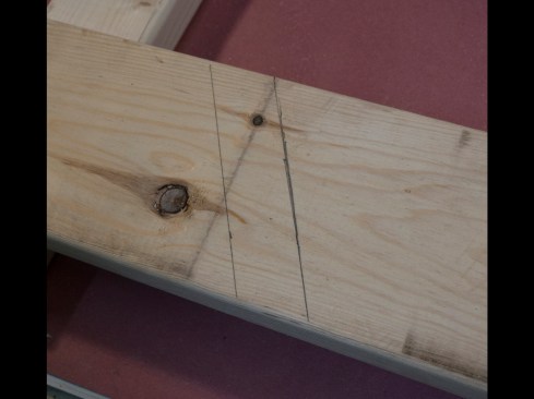 This photo shows the plumb cut I measured 9 inches away from the birdsmouth and the line I drew to shorten the tail for the subfascia.