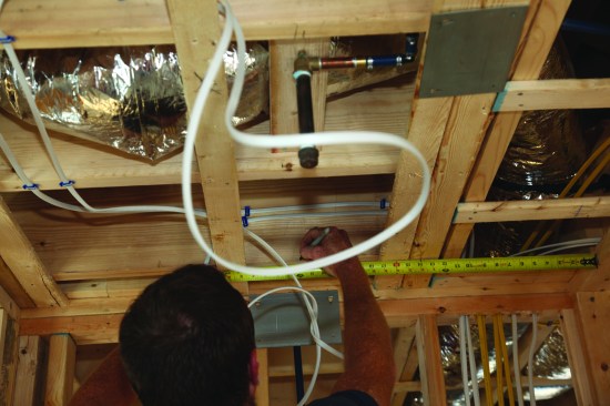 Next, he marked the centerline of the width of the shower.