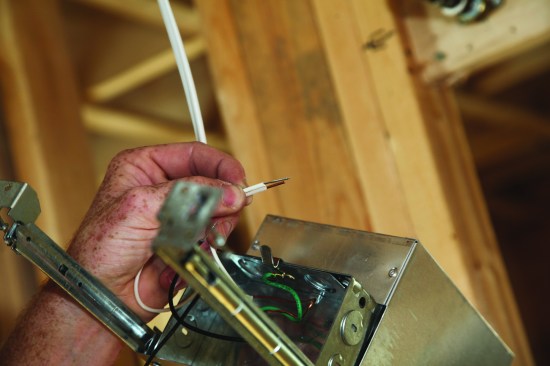 Leave the braided fixture wires longer than the solid switch-leg conductors.