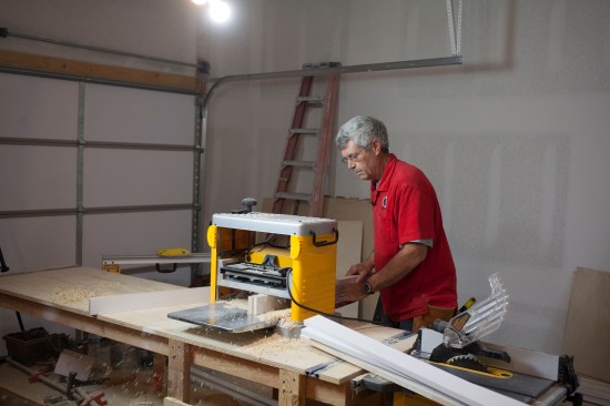 The author sends the frame pieces through a planer on edge to ensure that they are exactly the sme width.