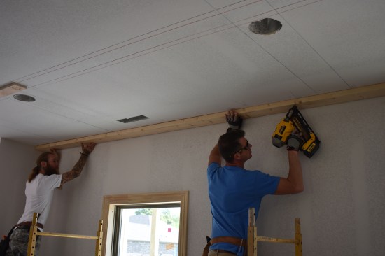 Around the room, 2x6s are attached to the ceiling as nailers for the 5 1/2-inch-wide perimeter beam.