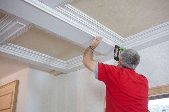 After the scribe fit, the bed molding nails into place to complete the transition down to the major beam layer.