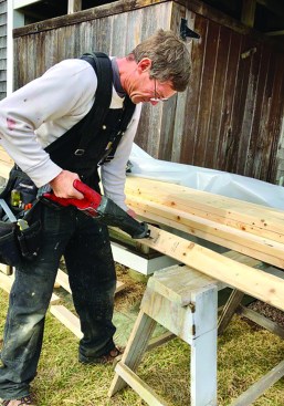 A narrow blade in a recip saw makes it easy to cut out a curved notch in a stud.