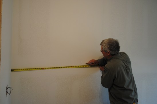 The author first draws a full-scale layout of the wall panels, getting proportions right and making sure electrical boxes fall in the field of the flat panels.  