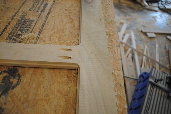 The first router pass is done with the bit with the large bearing. This pass is a shallow cut that leaves a clean edge on the front edge. 