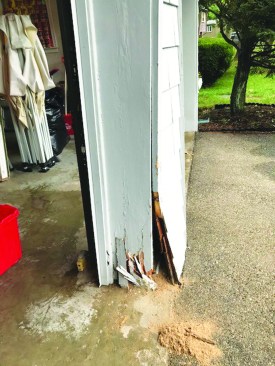 After being struck by a car, the garage support showed signs of internal rot as well as structural damage.