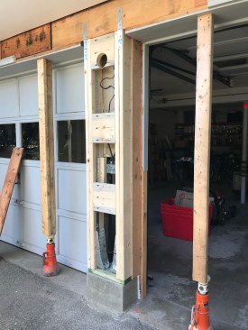 Solid 2-by blocks span between the studs on either side of the garage support to add
rigidity.