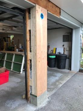 The treated sill had been kept back 1/2 inch from the face of the footing so the sheathing could be installed flush (13). The exterior of the support was finished with cedar shingles and PVC trim to match the house.